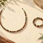 Illustration of a long bead strand beside a separate wrist bracelet