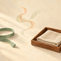 Editorial illustration of bracelet gift decisions: fit, scent preference, and everyday care